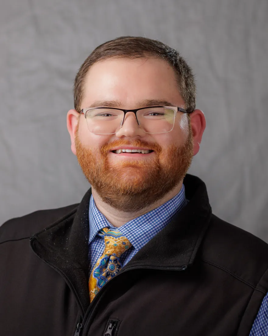 A man smiles for the camera